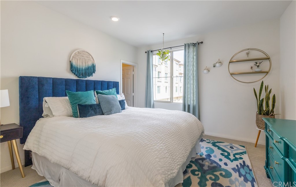 75 Plateau Irvine, CA 92618 - Photo 16 of 29 a bedroom with a bed a mirror and a window