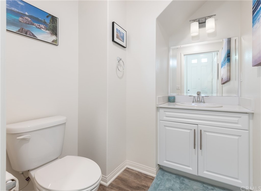 75 Plateau Irvine, CA 92618 - Photo 22 of 29 a bathroom with a toilet a sink and mirror