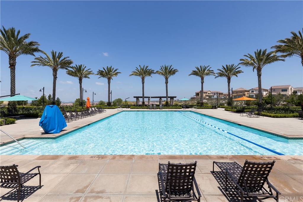 75 Plateau Irvine, CA 92618 - Photo 25 of 29 a view of swimming pool with outdoor seating and palm trees