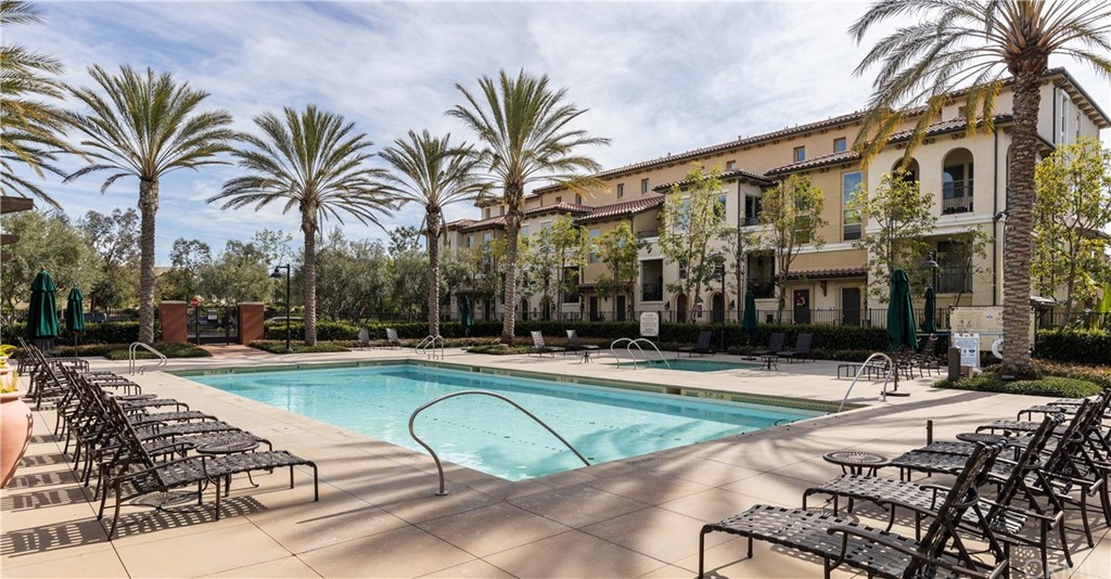 75 Plateau Irvine, CA 92618 - Photo 28 of 29 a view of swimming pool with outdoor seating and a palm tree