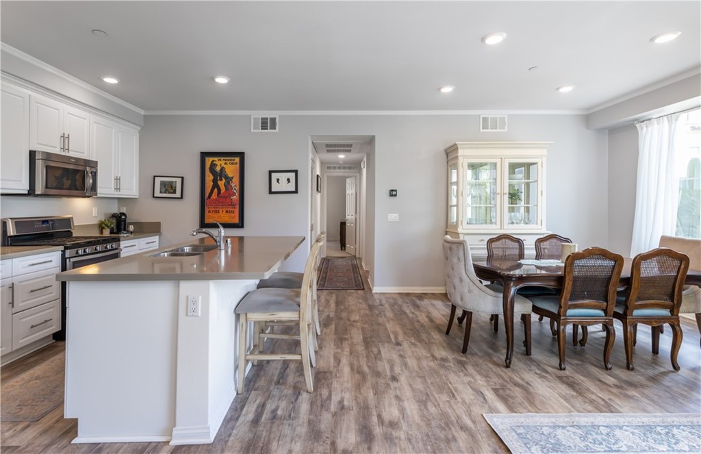 75 Plateau Irvine, CA 92618 - Photo 4 of 29 a living room with granite countertop furniture and wooden floor