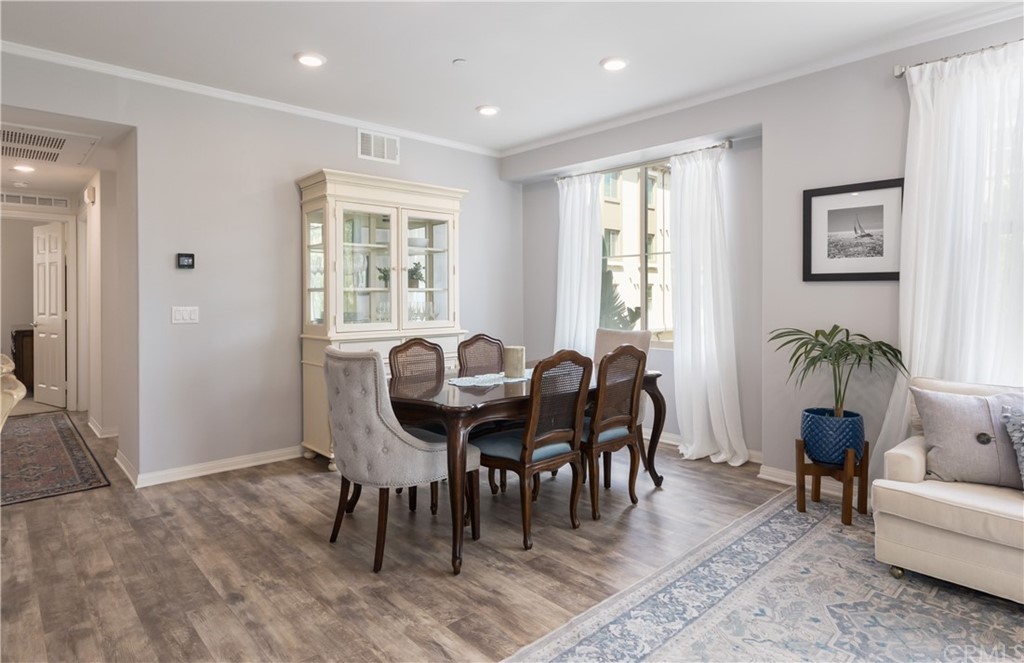 75 Plateau Irvine, CA 92618 - Photo 5 of 29 a view of a dining room with furniture window and wooden floor
