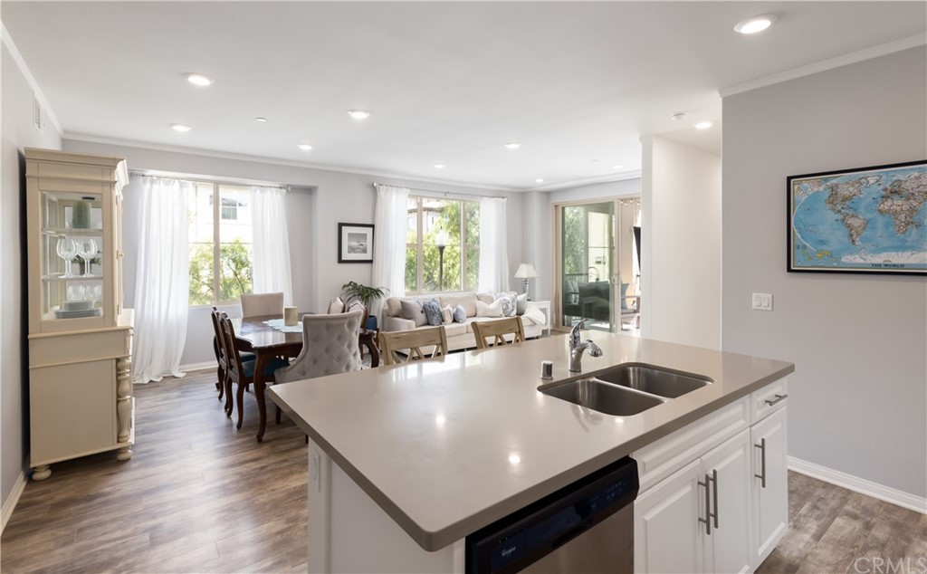 75 Plateau Irvine, CA 92618 - Photo 8 of 29 a view of kitchen island a sink and living room
