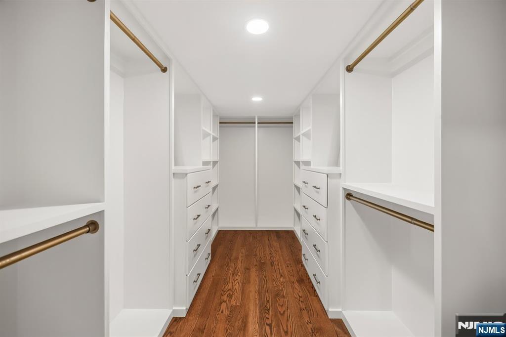 120 Hope Street Ridgewood, NJ 07450 - Photo 17 of 37 a hallway with white cabinets and wooden floor