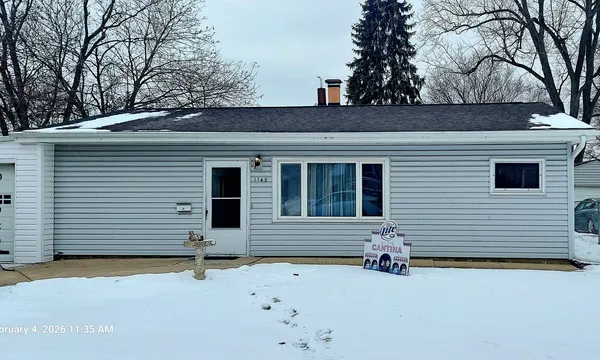 a view of a house with a garage