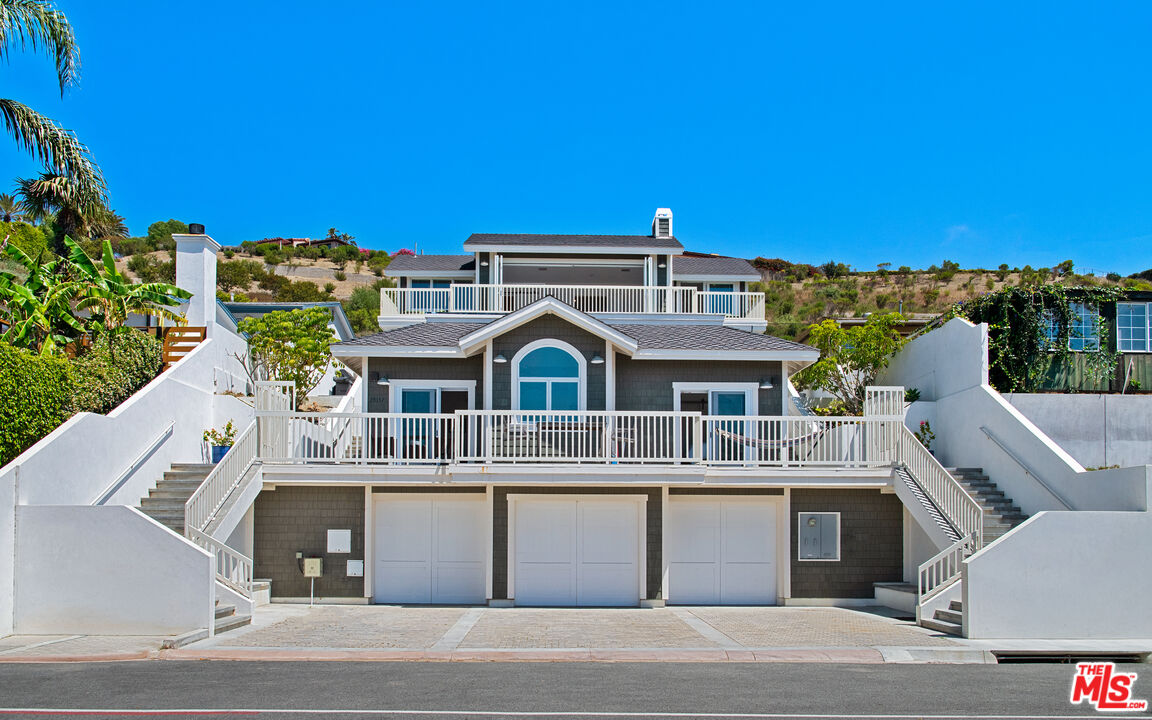 25157 Malibu Road Malibu, CA 90265 - Photo 2 of 33 a front view of a house with a yard