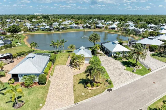 an aerial view of a house with a lake view