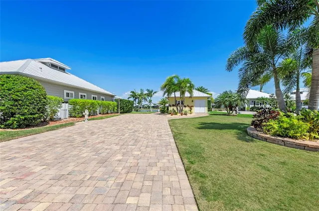 a view of a garden with a building in the background
