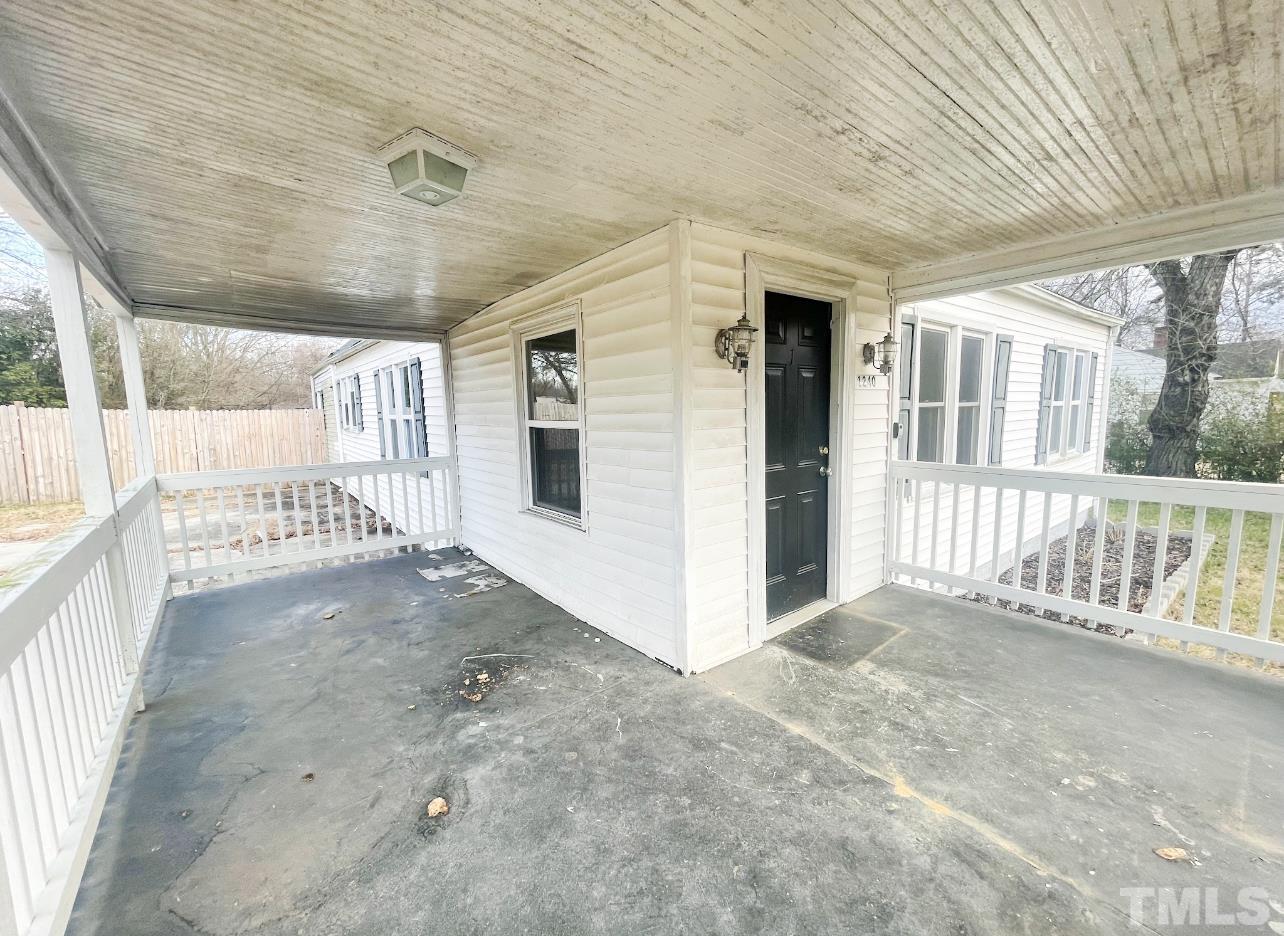 1240 Pointer Street Roxboro, NC 27573 - Photo 4 of 20 a view of a porch with a table and chairs