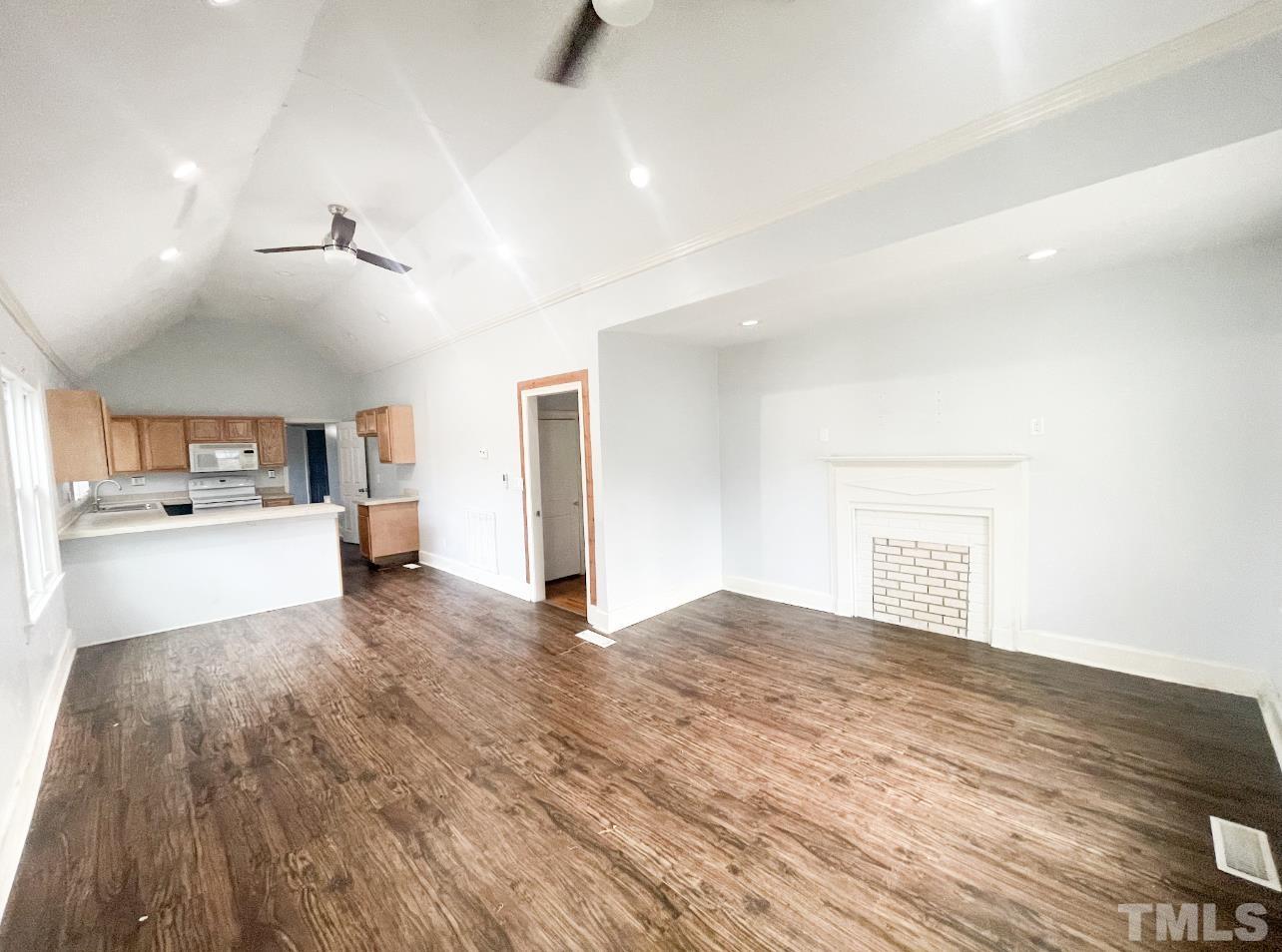 1240 Pointer Street Roxboro, NC 27573 - Photo 5 of 20 a view of kitchen and hall with wooden floor