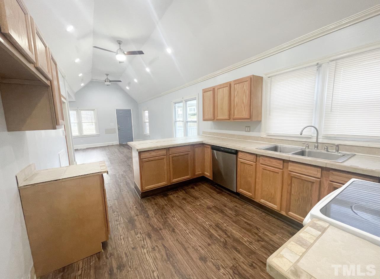 1240 Pointer Street Roxboro, NC 27573 - Photo 9 of 20 a kitchen with a sink a window and cabinets