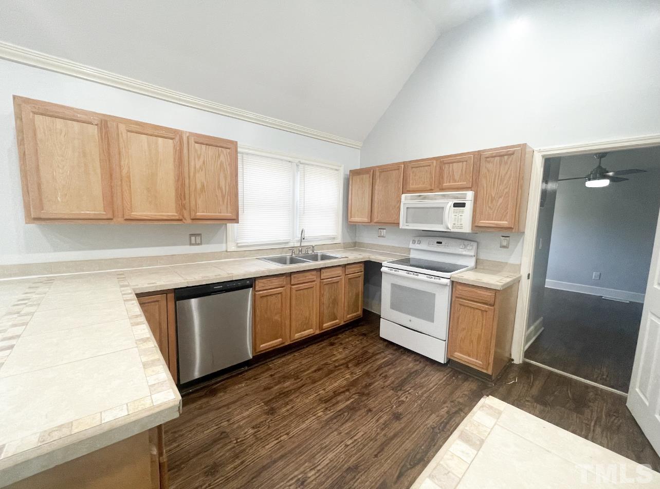 1240 Pointer Street Roxboro, NC 27573 - Photo 10 of 20 a kitchen with a white stove top oven and sink