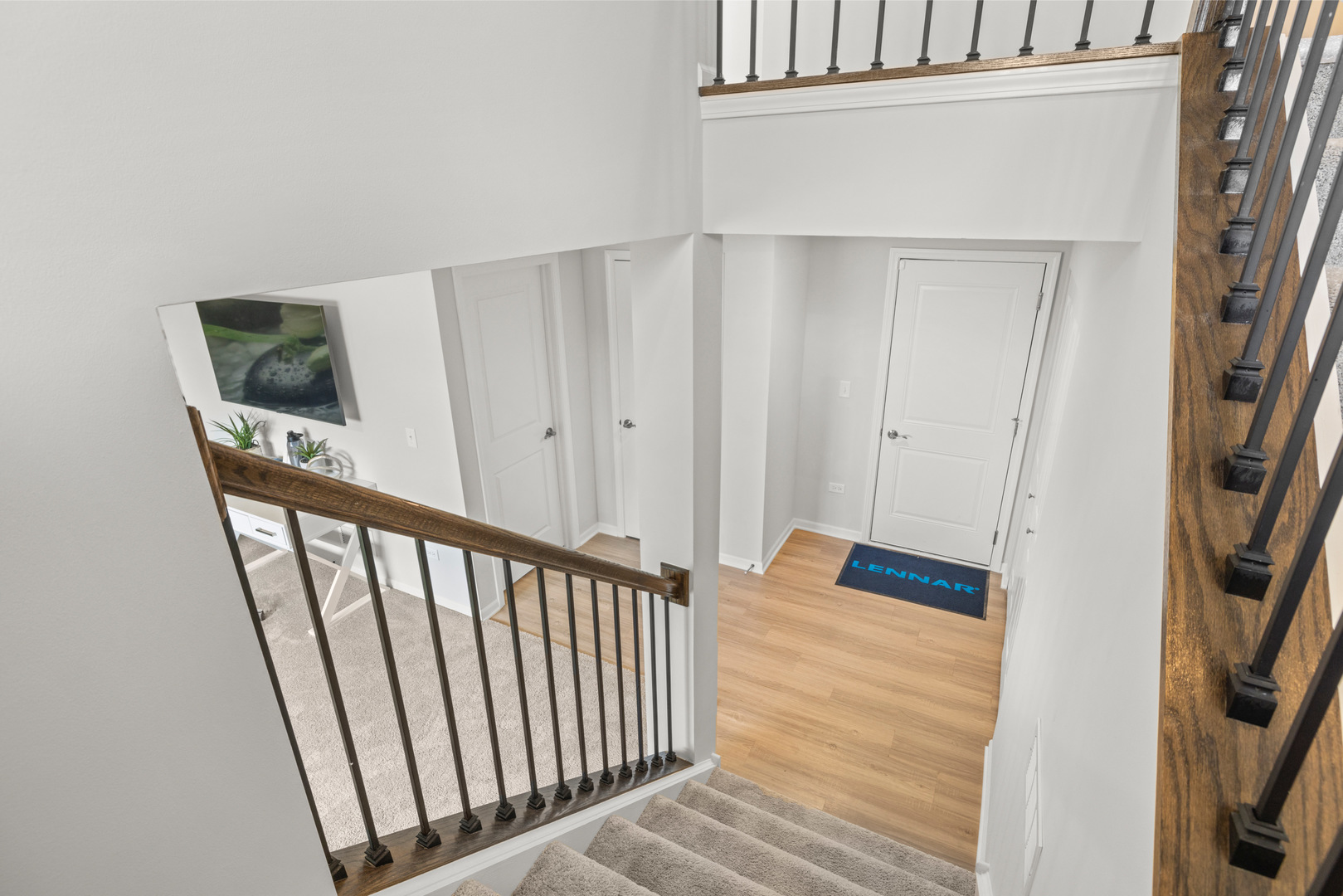 523 Wolverine Drive Aurora, IL 60502 - Photo 17 of 30 a view of a hallway with wooden floor and staircase
