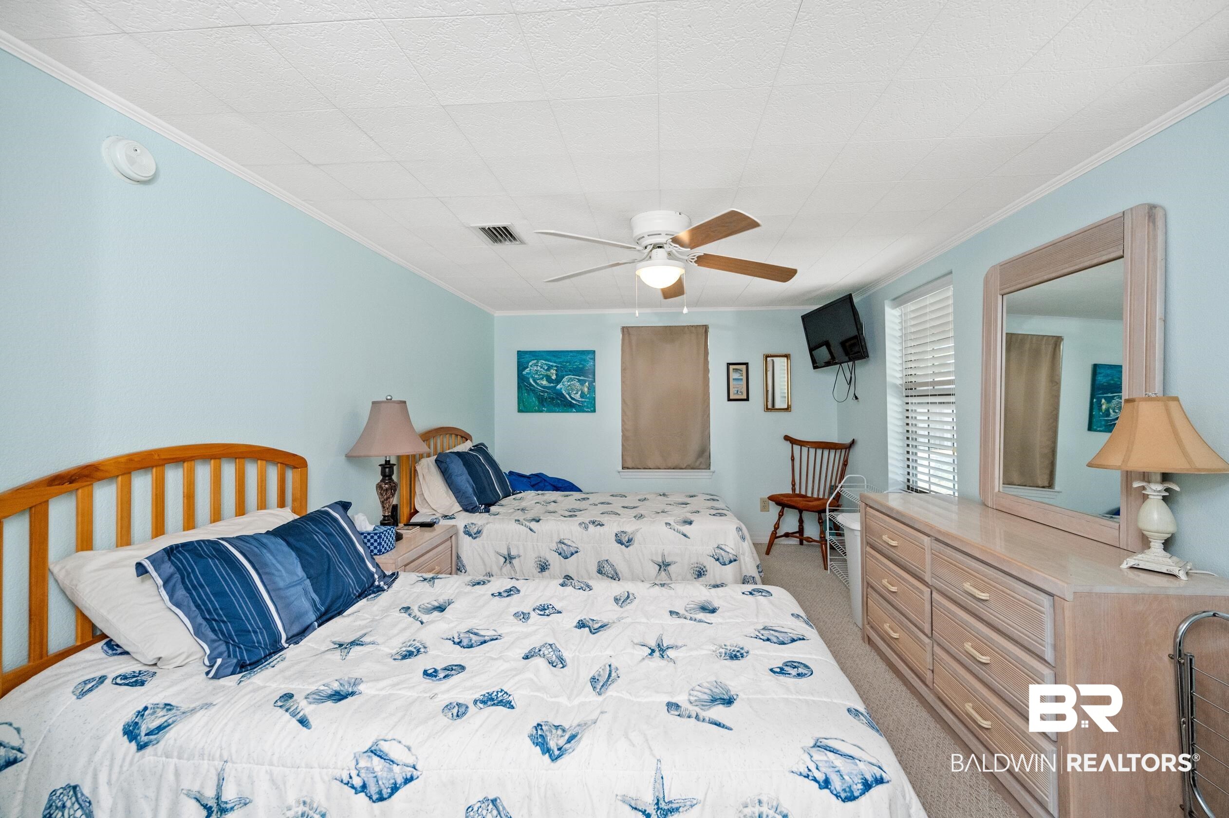 5392 Ornacor Avenue Orange Beach, AL 36561 - Photo 18 of 48 Carpeted bedroom featuring ceiling fan and crown molding