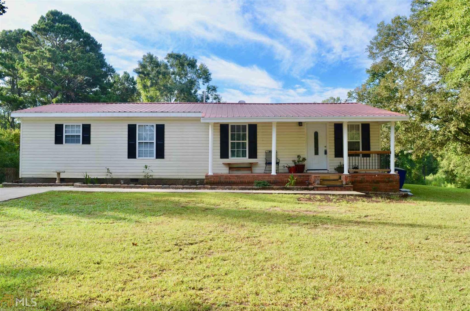 a view of a house with swimming pool yard and patio