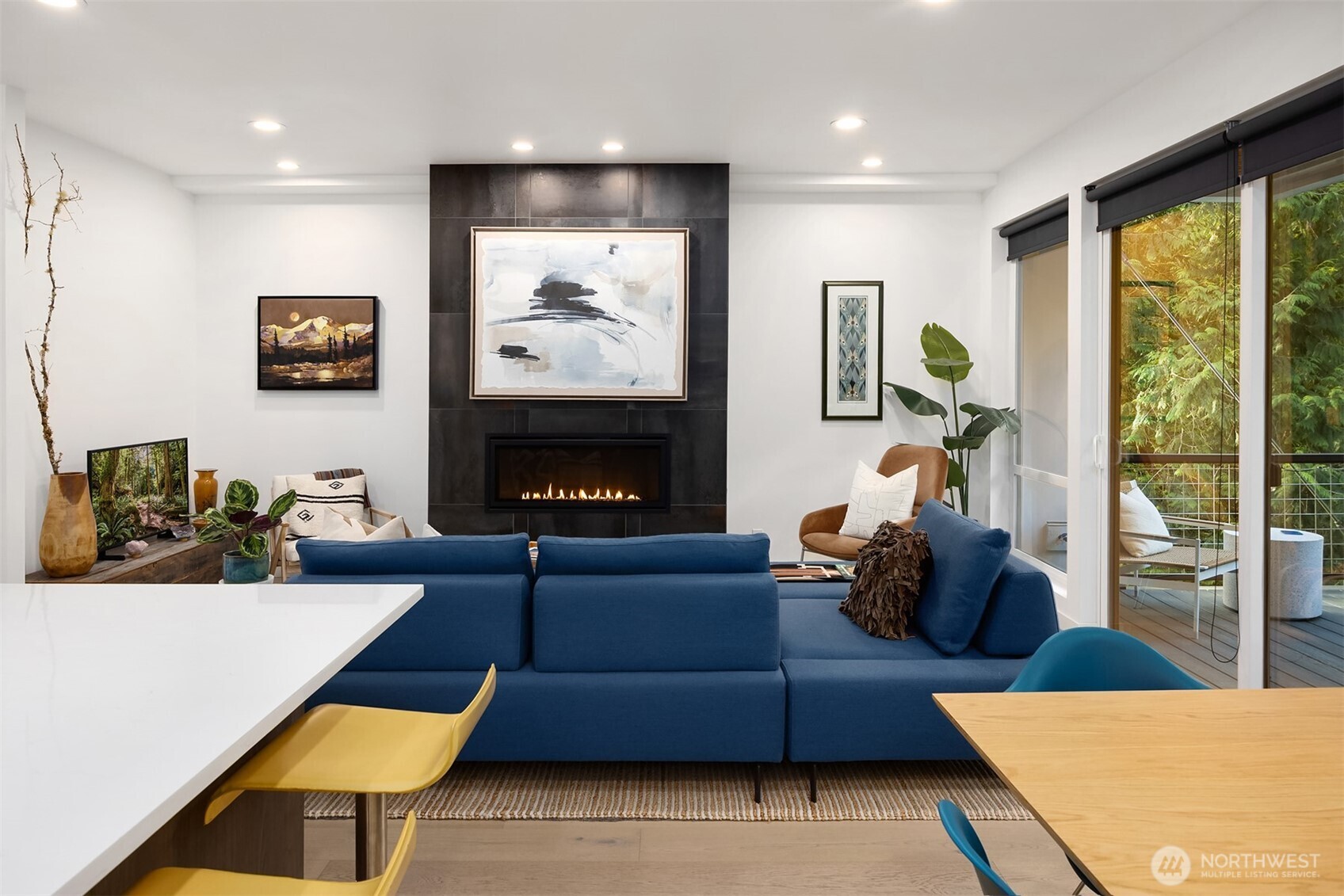 13532 Phelps Road Northeast Bainbridge Island, WA 98110 - Photo 15 of 35 a living room with furniture a large window and a flat screen tv