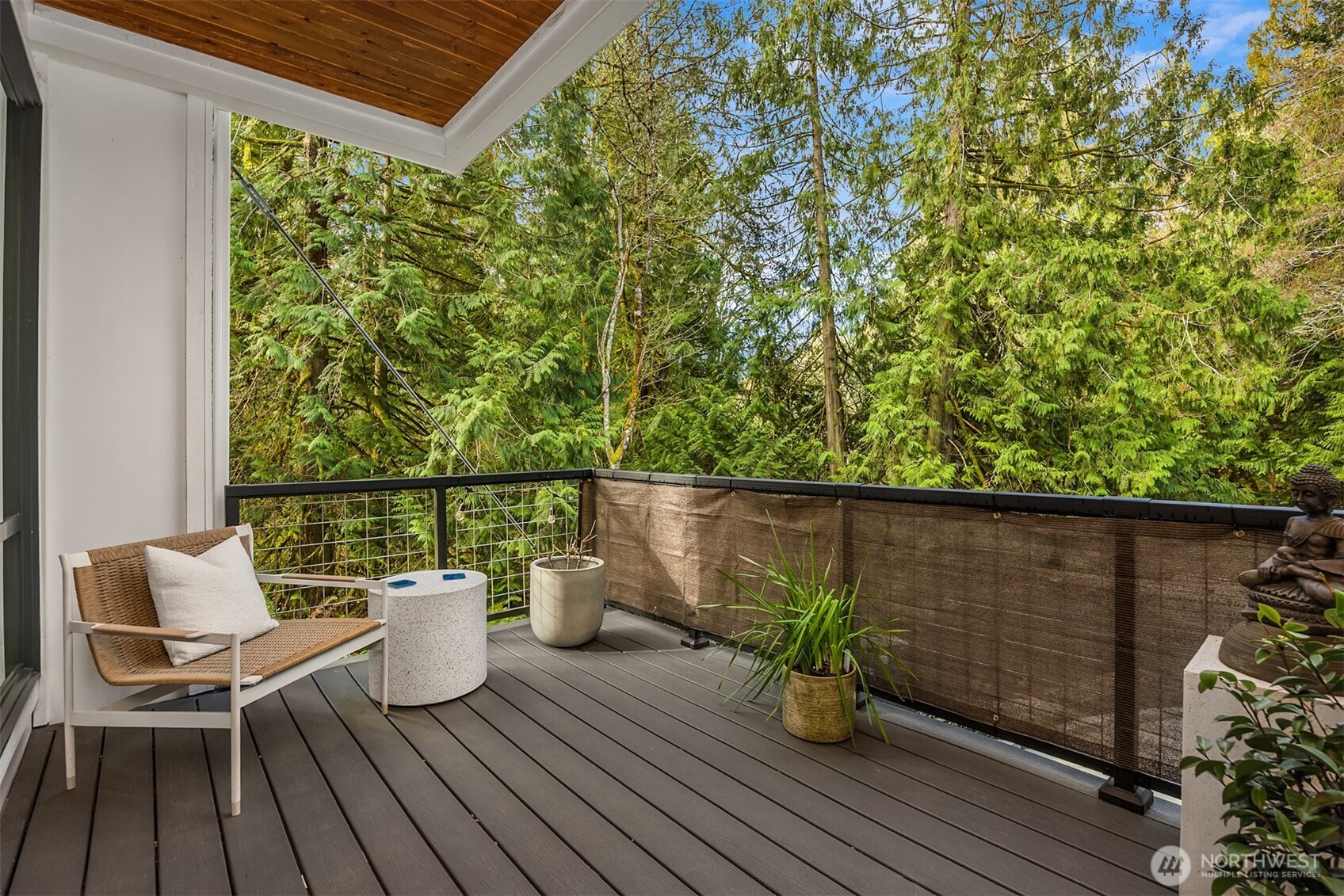13532 Phelps Road Northeast Bainbridge Island, WA 98110 - Photo 17 of 35 a balcony with wooden floor table and chairs