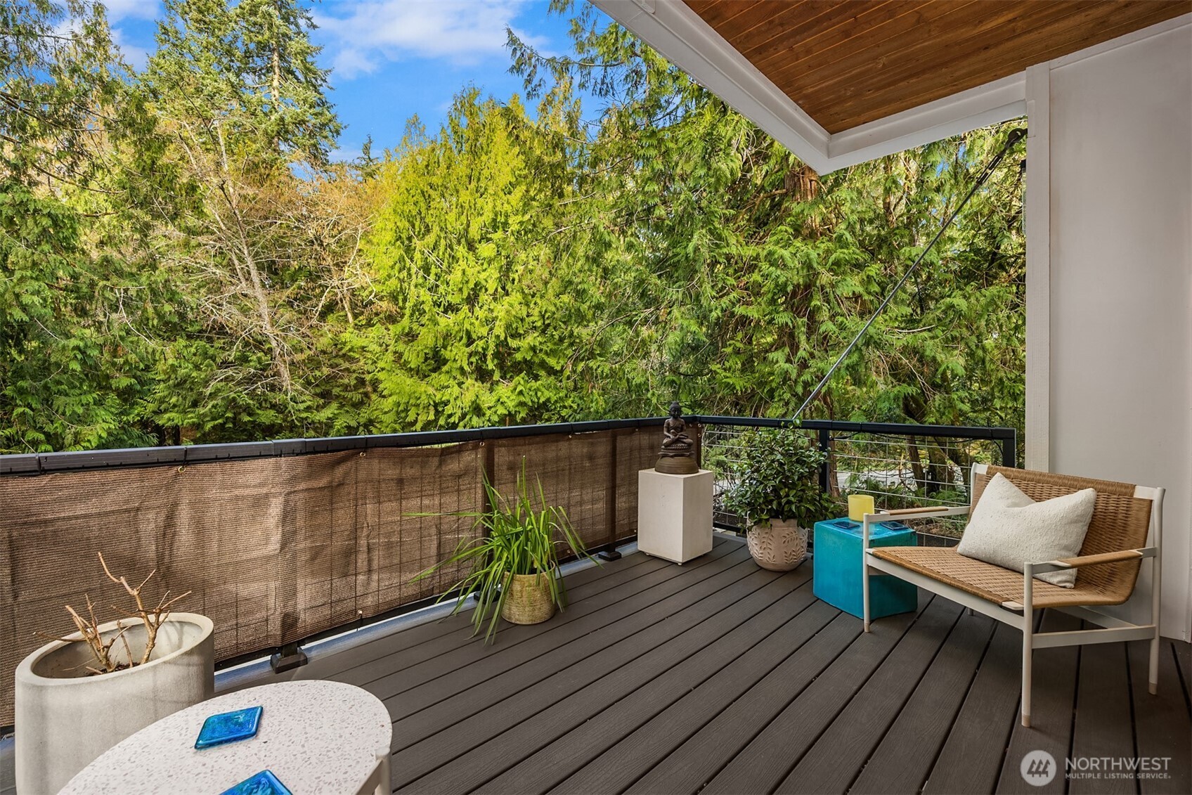 13532 Phelps Road Northeast Bainbridge Island, WA 98110 - Photo 19 of 35 a view of a chairs and table on the wooden roof deck