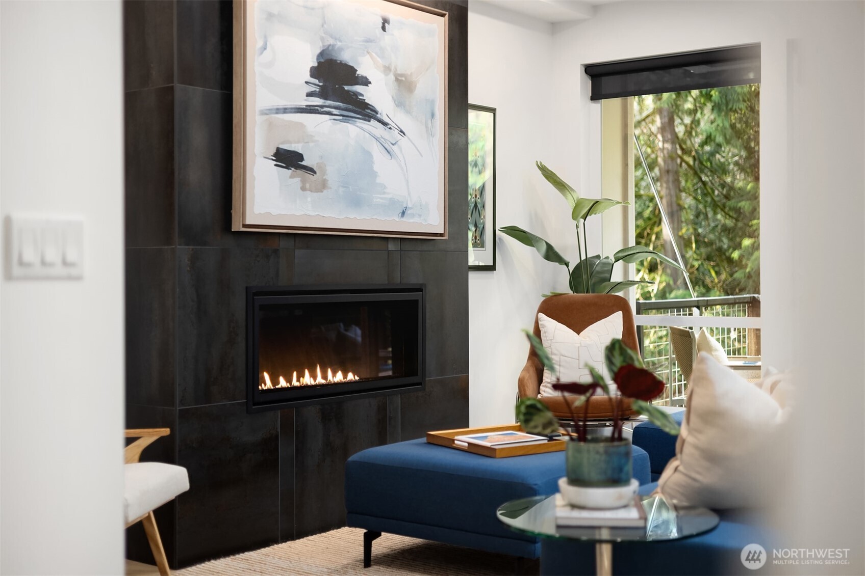 13532 Phelps Road Northeast Bainbridge Island, WA 98110 - Photo 6 of 35 a living room with furniture a fireplace and a floor to ceiling window