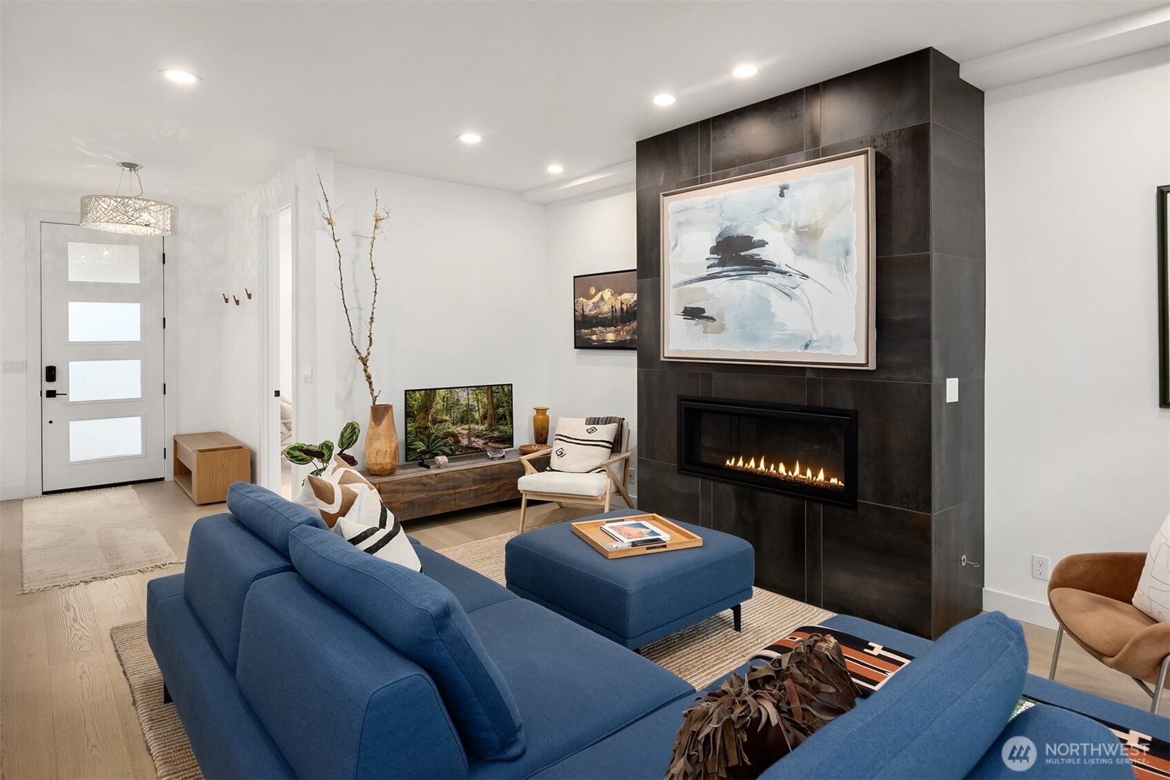 13532 Phelps Road Northeast Bainbridge Island, WA 98110 - Photo 7 of 35 a living room with furniture and a fireplace