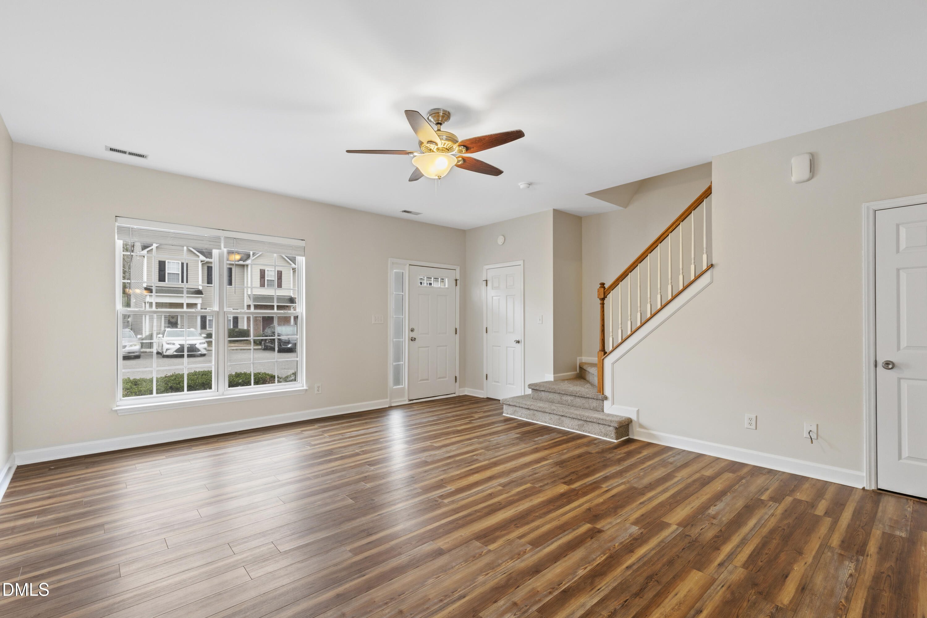 6013 San Marcos Way Raleigh, NC 27616 - Photo 5 of 21 wooden floor in an empty room with a window