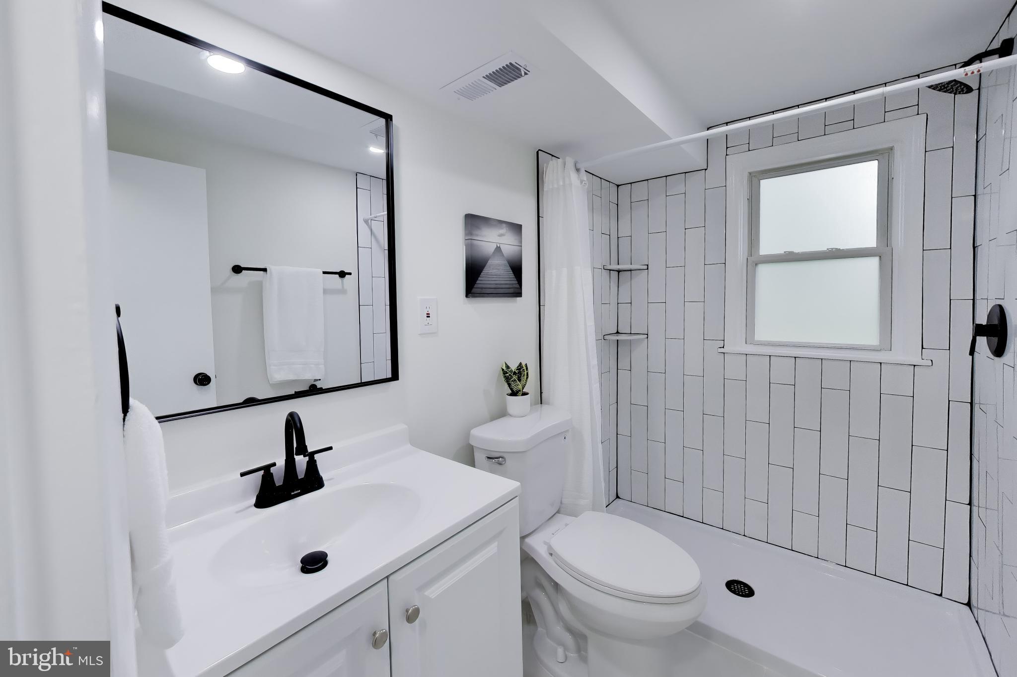 11309 Keystone Avenue Clinton, MD 20735 - Photo 28 of 36 a bathroom with a sink toilet and shower