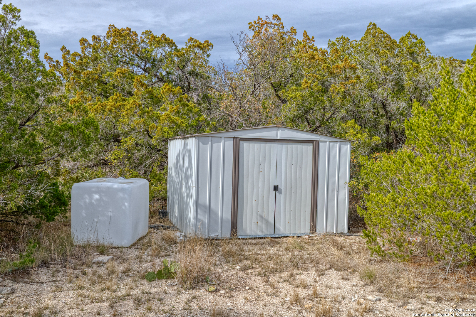 25 Sd 65065 Dusty Rose Ranch Rocksprings, TX 78880 - Photo 14 of 59 a backyard of a house