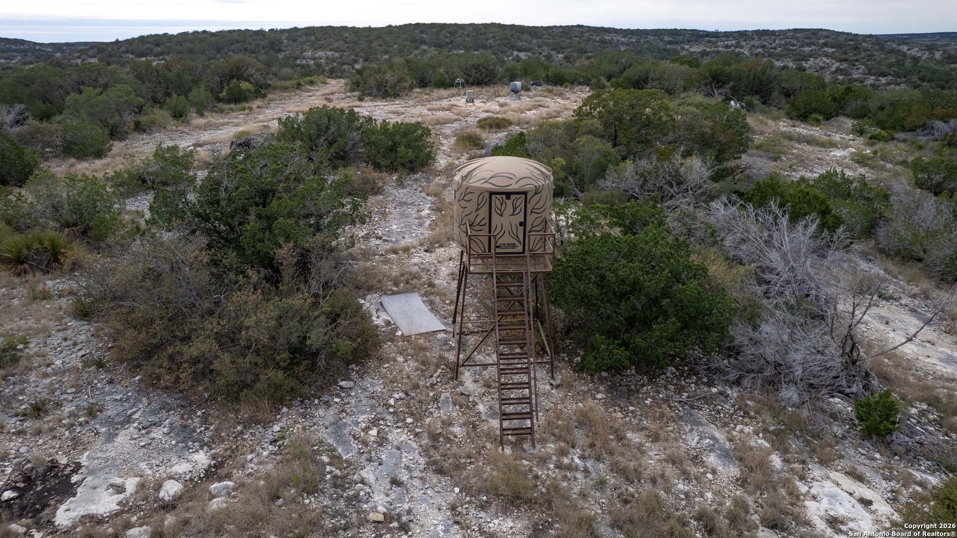 25 Sd 65065 Dusty Rose Ranch Rocksprings, TX 78880 - Photo 38 of 59 a backyard of a house with lots of green space