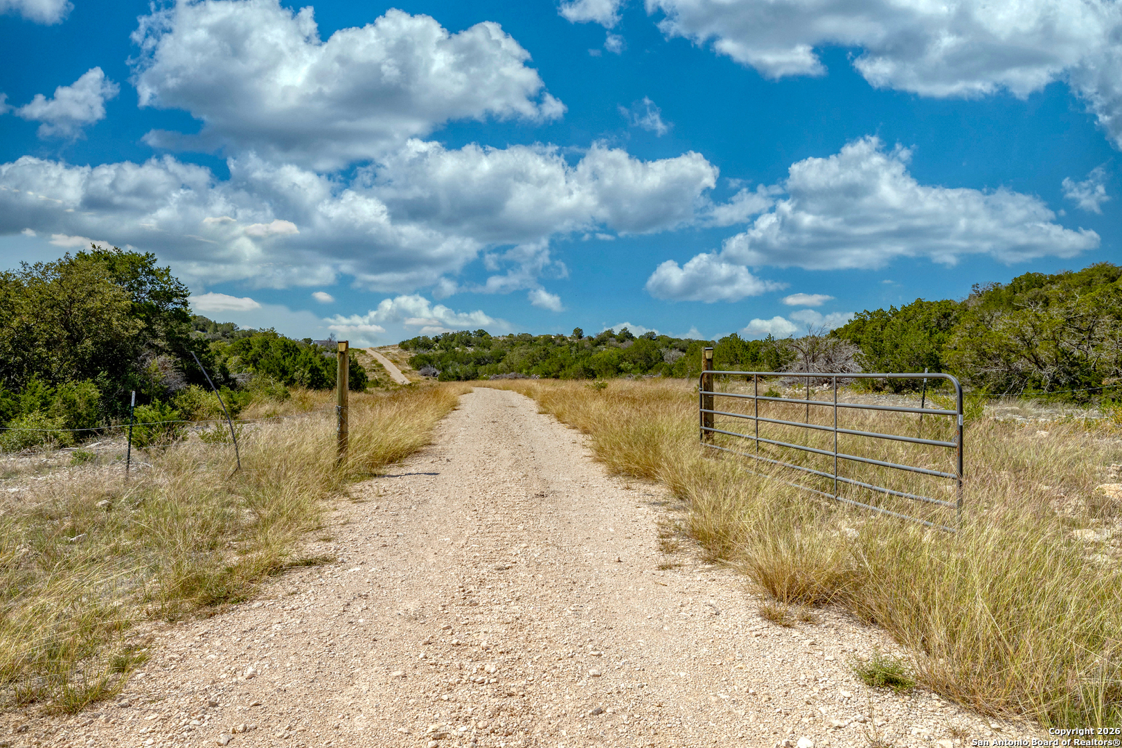 25 Sd 65065 Dusty Rose Ranch Rocksprings, TX 78880 - Photo 45 of 59 a view of a lake with a yard