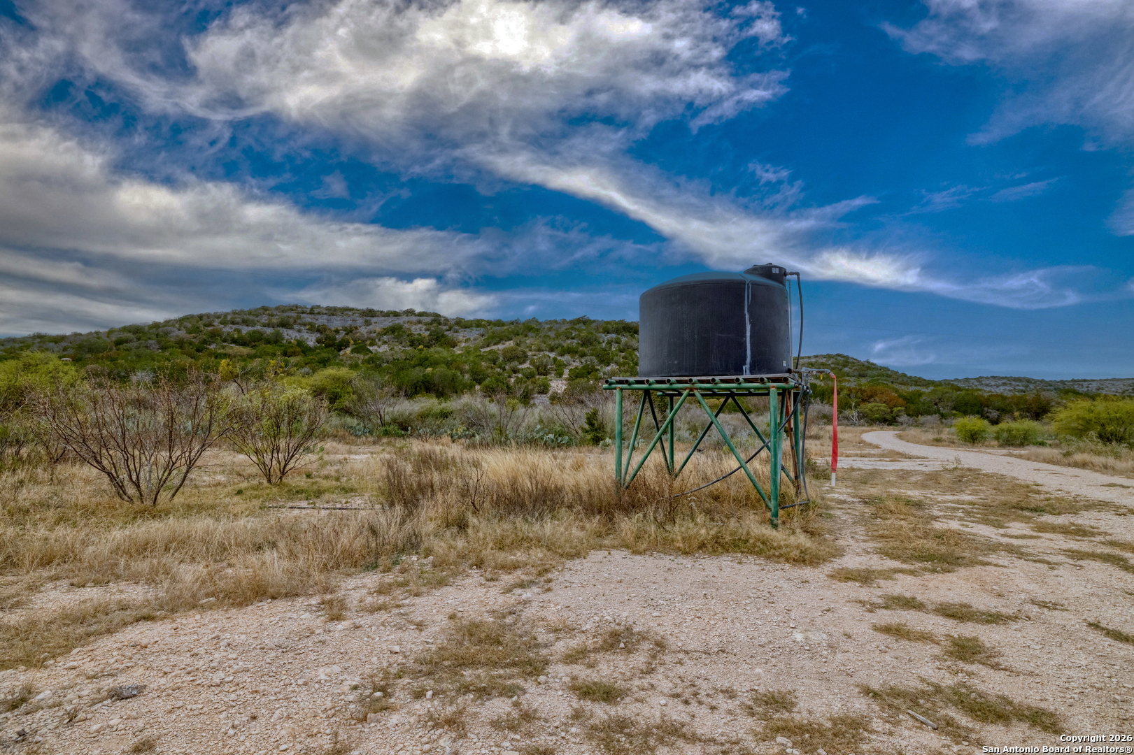 25 Sd 65065 Dusty Rose Ranch Rocksprings, TX 78880 - Photo 46 of 59 a view of a dry yard with wooden fence