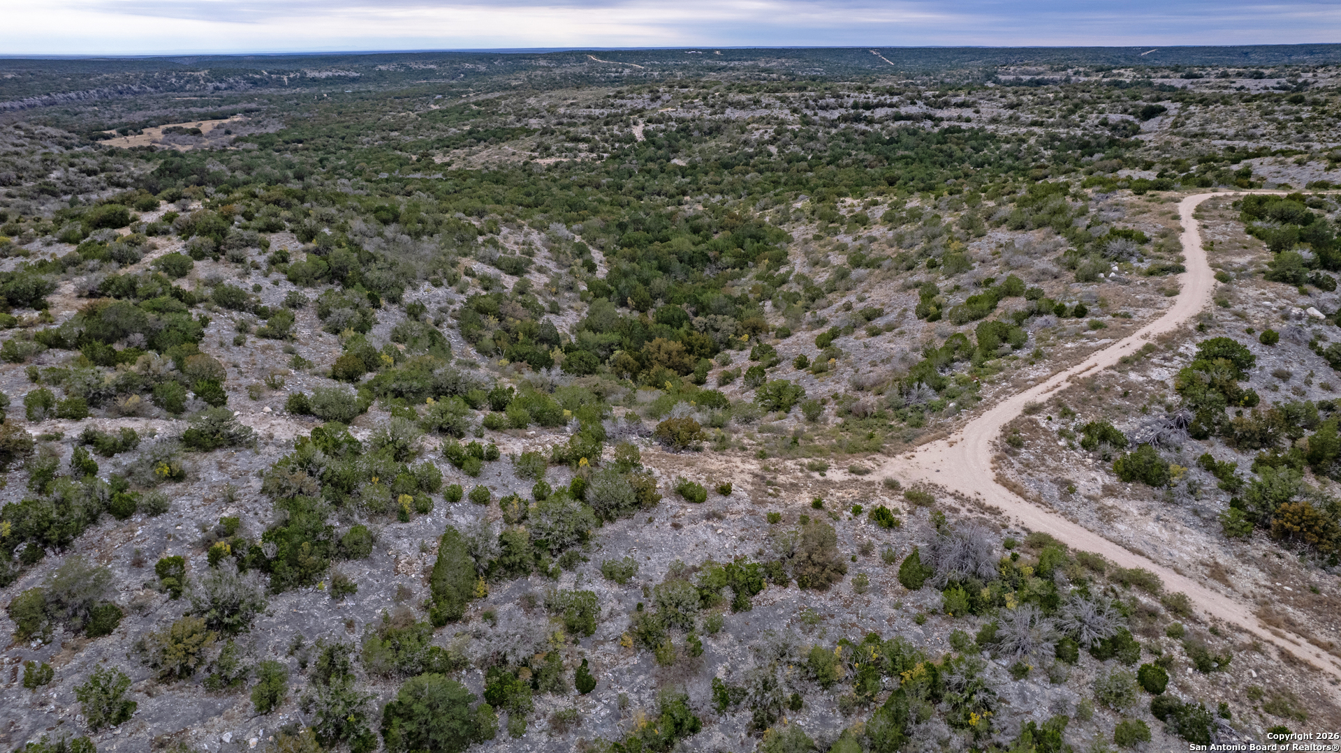 25 Sd 65065 Dusty Rose Ranch Rocksprings, TX 78880 - Photo 53 of 59 an aerial view of residential house and outdoor space