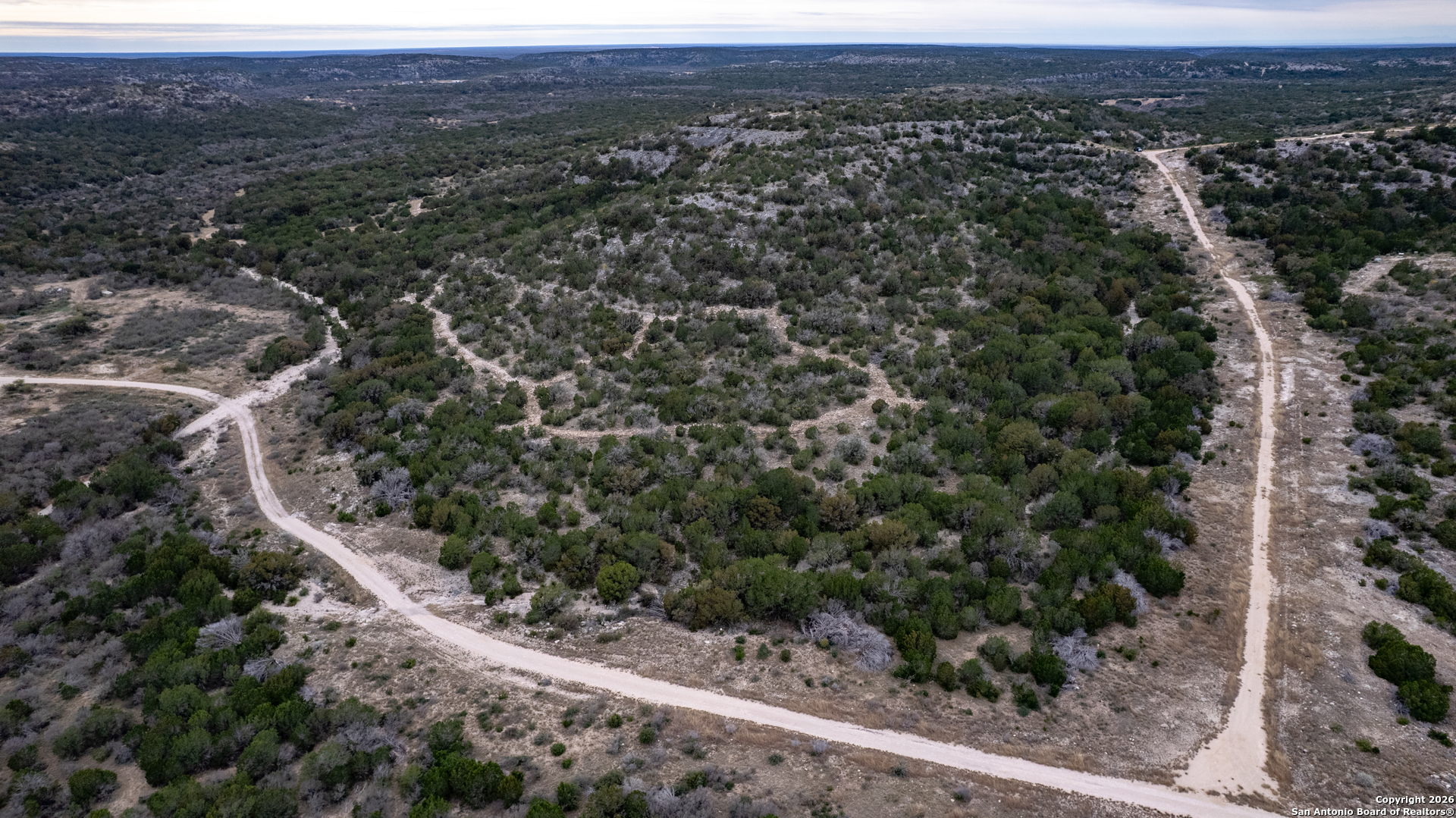 25 Sd 65065 Dusty Rose Ranch Rocksprings, TX 78880 - Photo 56 of 59 an aerial view of residential house and green space