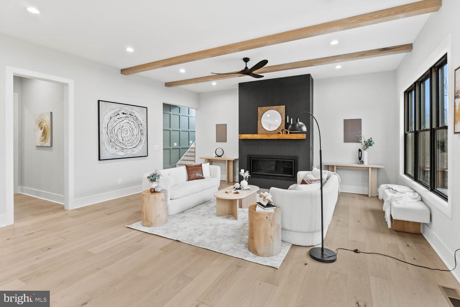 402 Marshall Road Southwest Vienna, VA 22180 - Photo 11 of 78 a living room with furniture a flat screen tv and a fireplace