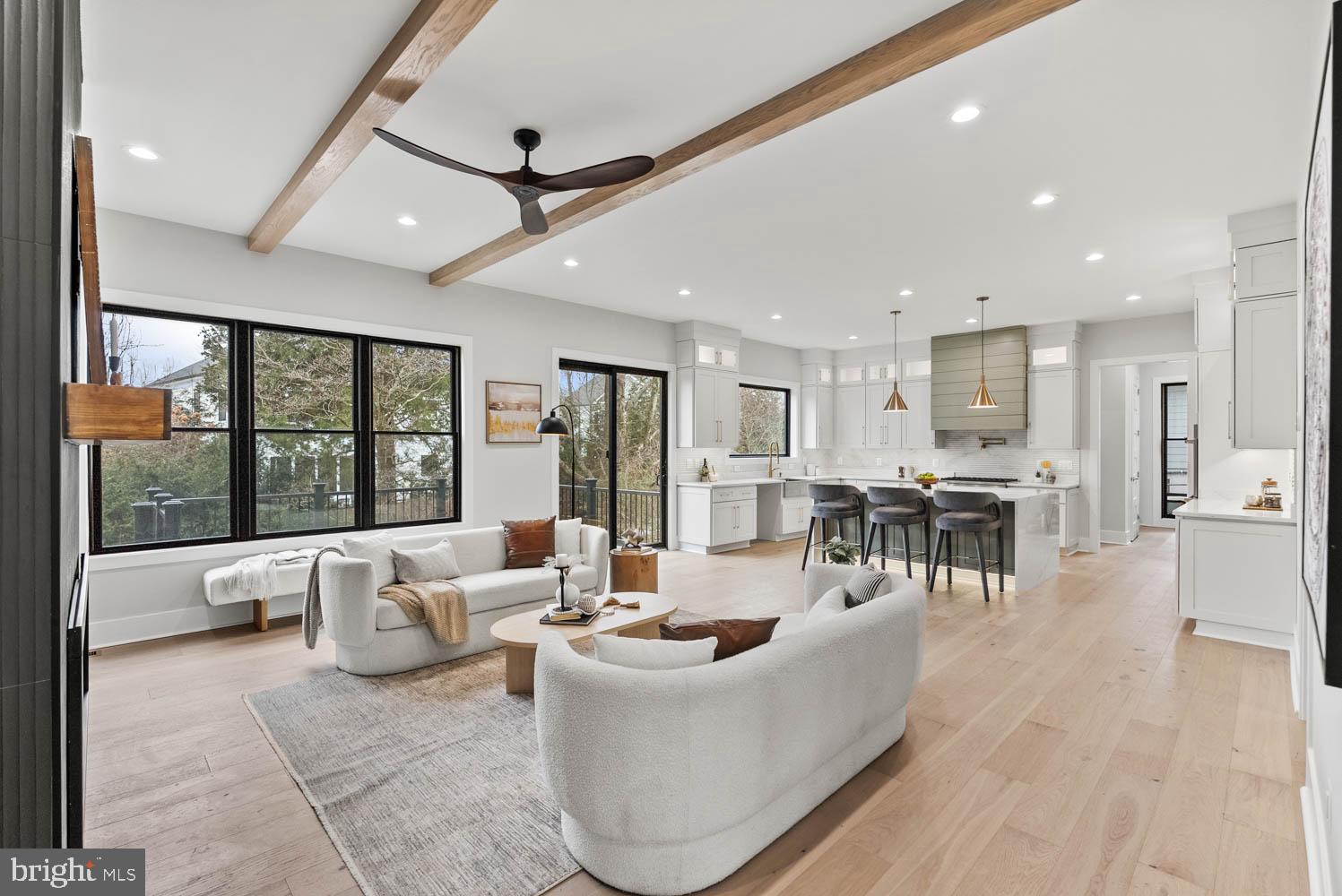 402 Marshall Road Southwest Vienna, VA 22180 - Photo 13 of 78 a living room with couches and kitchen view with wooden floor