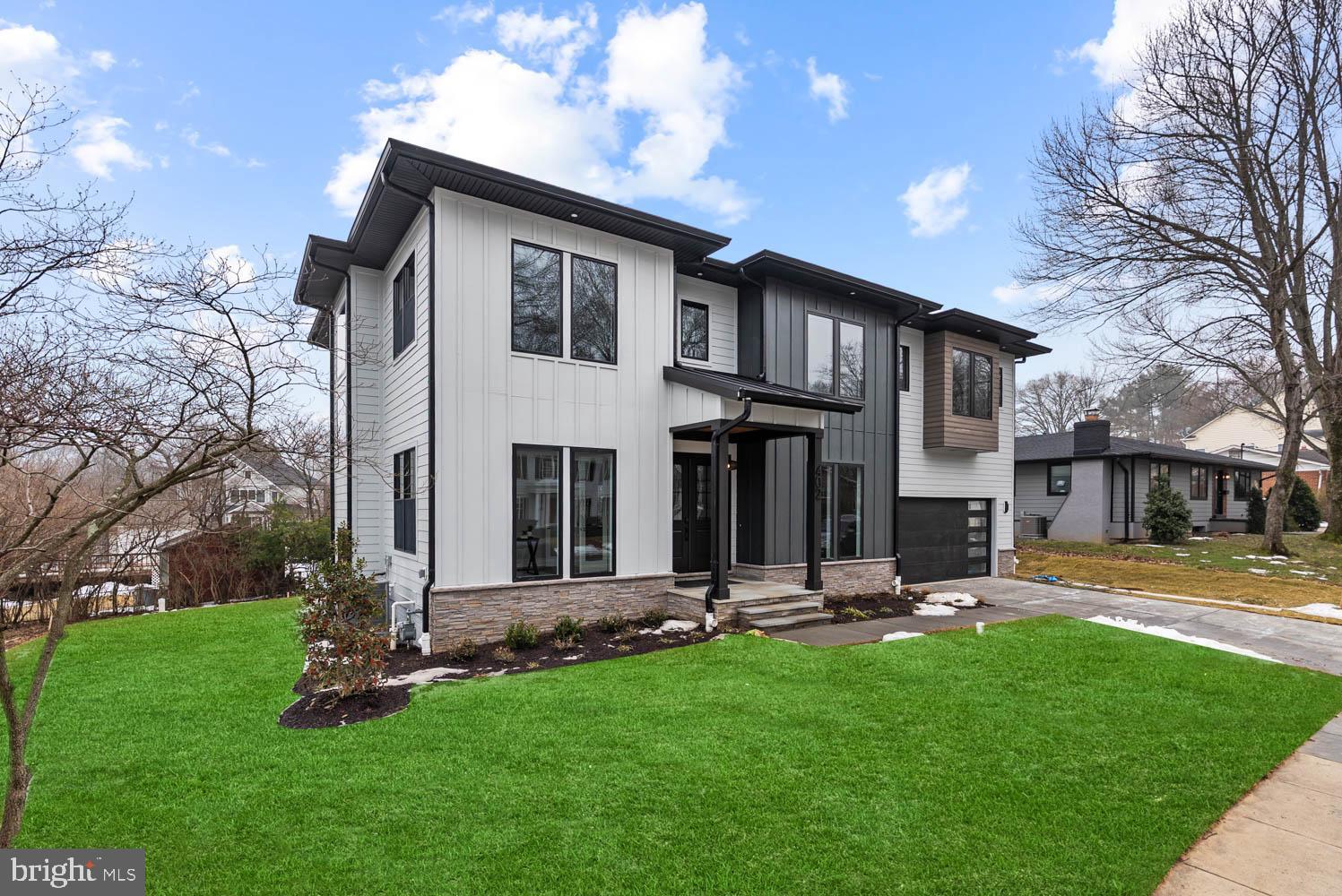 402 Marshall Road Southwest Vienna, VA 22180 - Photo 2 of 78 a front view of a house with a yard