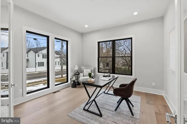 a living room with furniture and windows