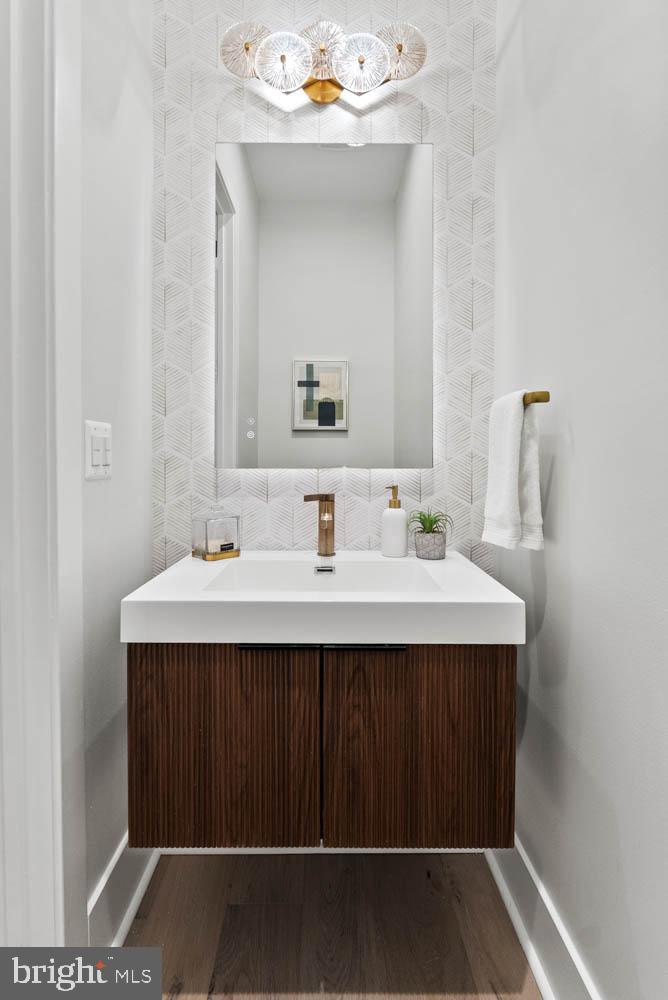 402 Marshall Road Southwest Vienna, VA 22180 - Photo 25 of 78 a bathroom with a sink and a mirror