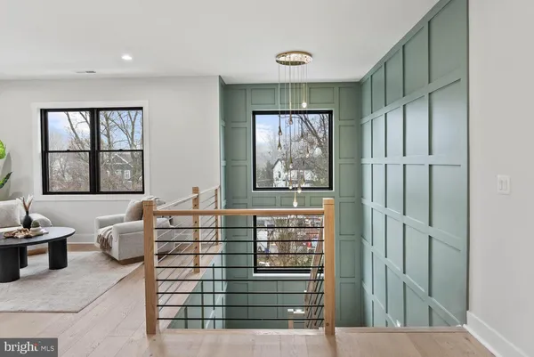 a view of an empty room with cabinet and window