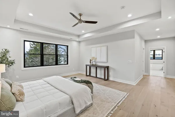 a view of a room with wooden floor and entryway