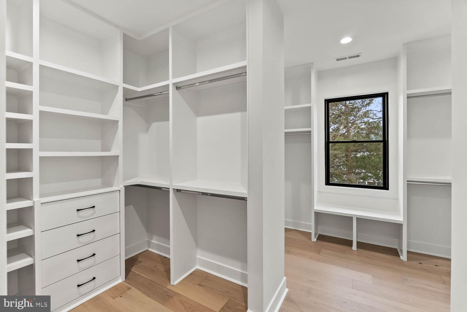 402 Marshall Road Southwest Vienna, VA 22180 - Photo 44 of 78 a view of an empty room with cabinet and window
