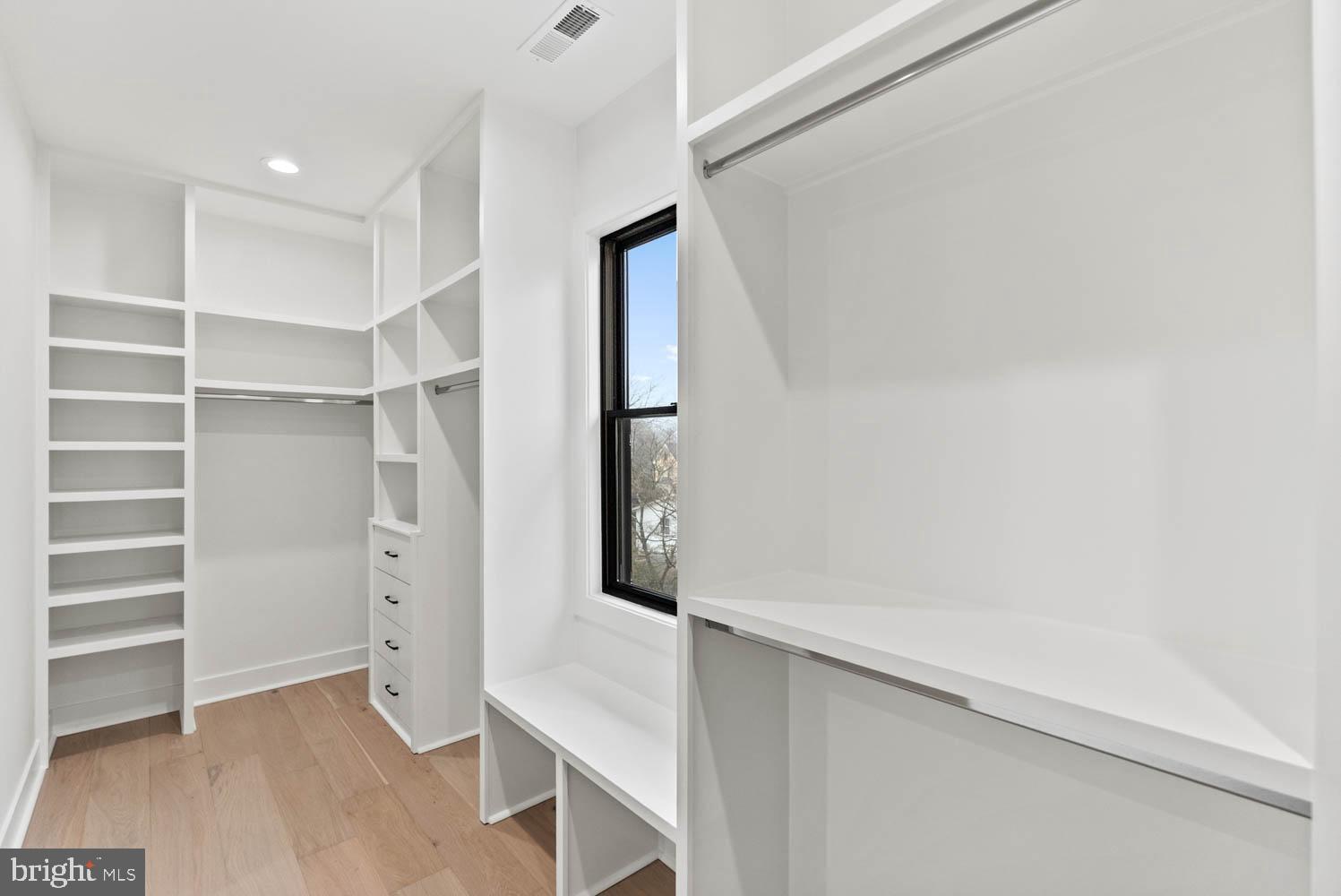 402 Marshall Road Southwest Vienna, VA 22180 - Photo 45 of 78 a view of walk in closet with empty racks