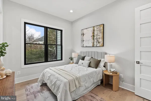 a view of a balcony with wooden floor and fence