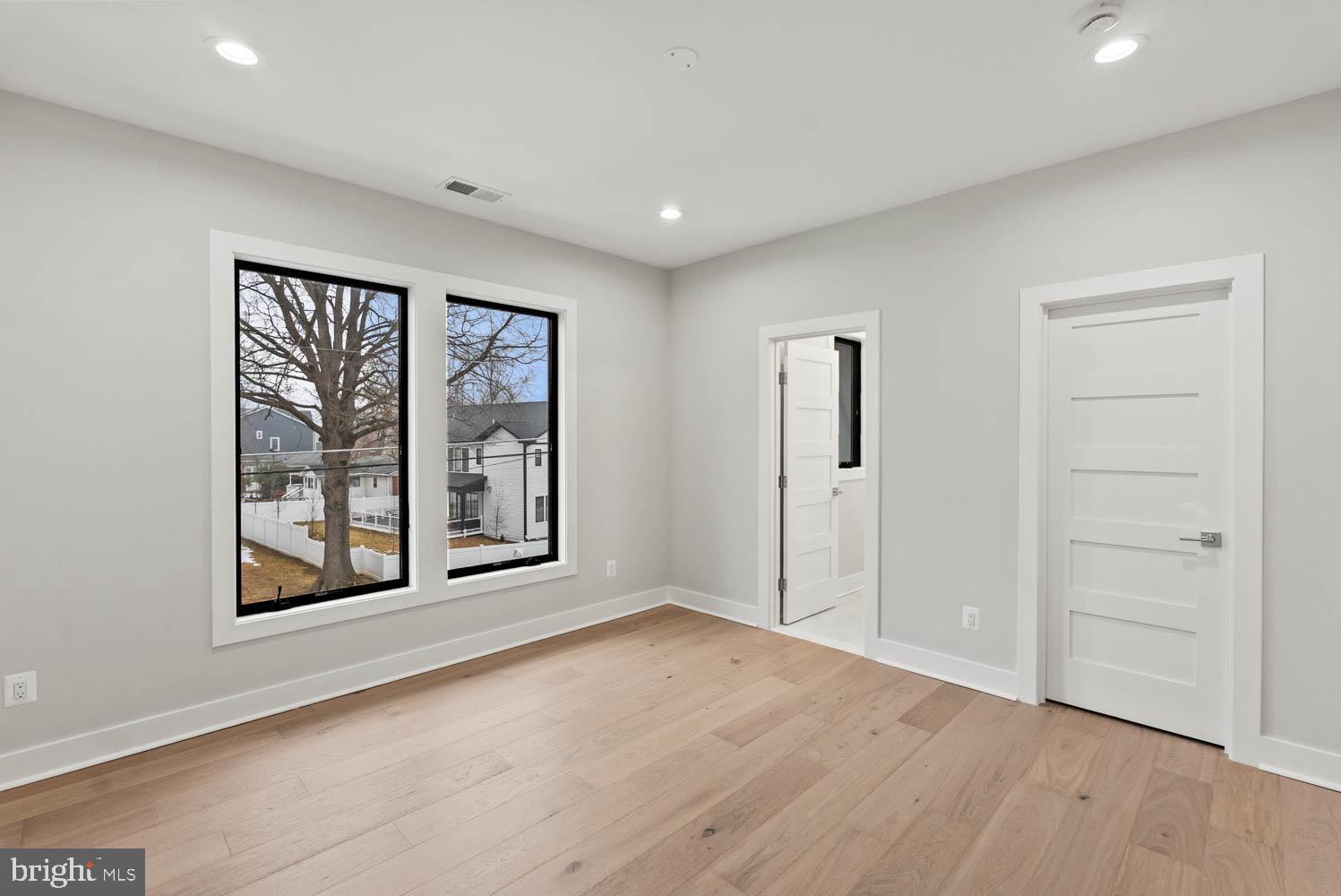 402 Marshall Road Southwest Vienna, VA 22180 - Photo 52 of 78 an empty room with windows and closet