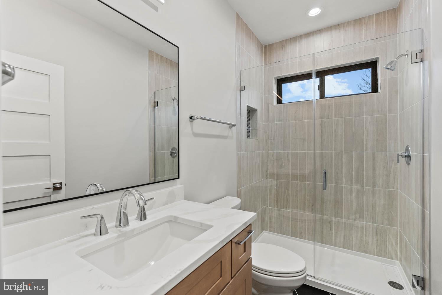 402 Marshall Road Southwest Vienna, VA 22180 - Photo 56 of 78 a bathroom with a sink toilet and shower