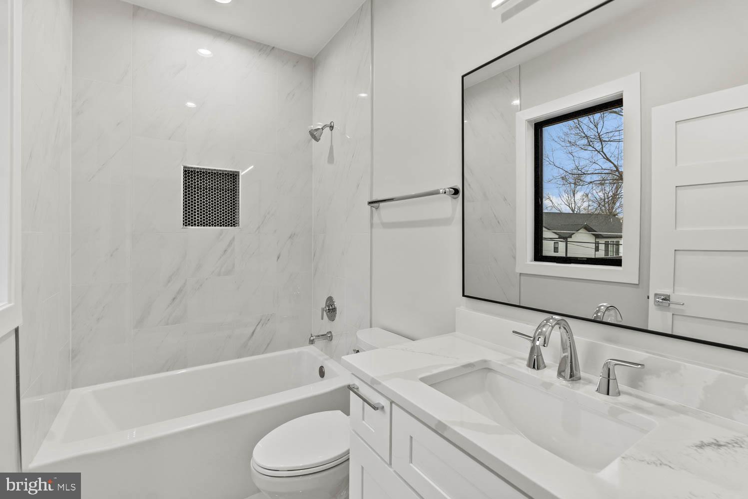 402 Marshall Road Southwest Vienna, VA 22180 - Photo 59 of 78 a bathroom with a toilet a sink and bathtub