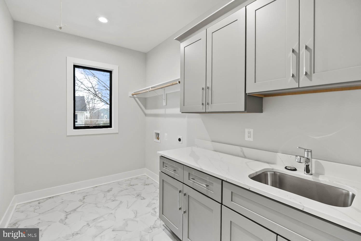 402 Marshall Road Southwest Vienna, VA 22180 - Photo 60 of 78 a kitchen with white cabinets and sink