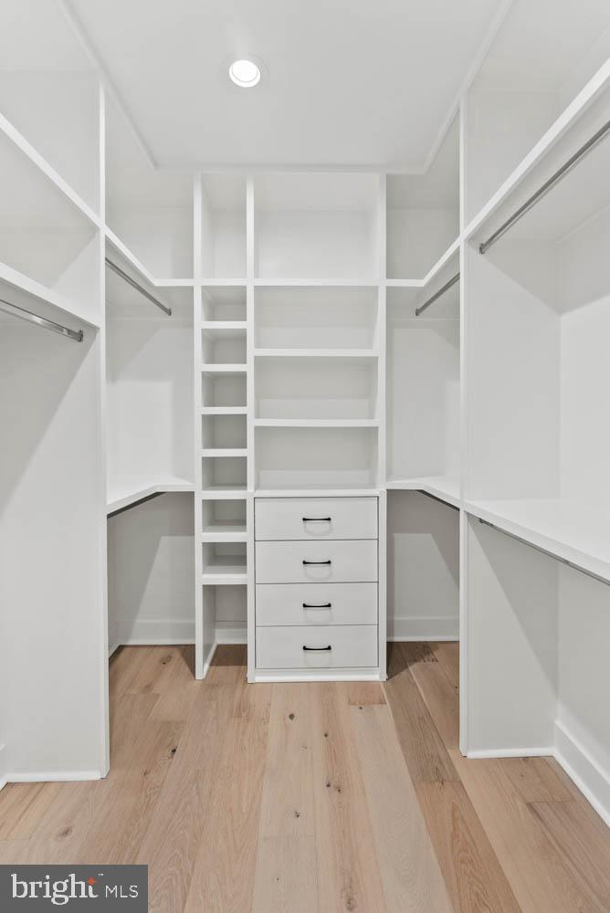 402 Marshall Road Southwest Vienna, VA 22180 - Photo 61 of 78 a view of walk in closet with empty racks