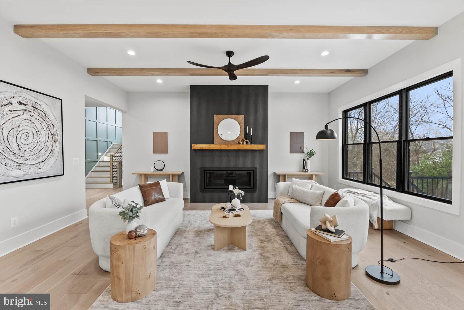 402 Marshall Road Southwest Vienna, VA 22180 - Photo 10 of 78 a living room with furniture and a fireplace