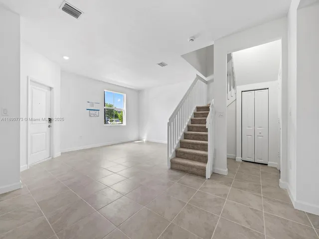 a view of an entryway with stairs
