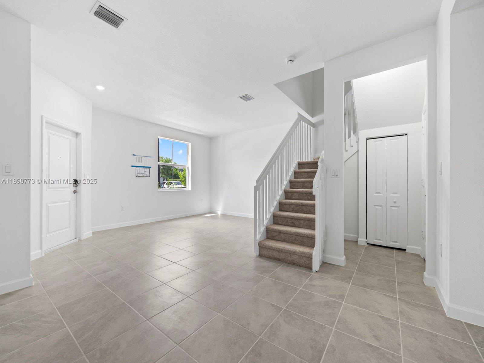 1525 Southeast 27th Street Homestead, FL 33035 - Photo 3 of 9 a view of an entryway with stairs